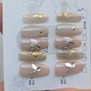 Elegant Nude and Gold Nail Set with Silver Accents